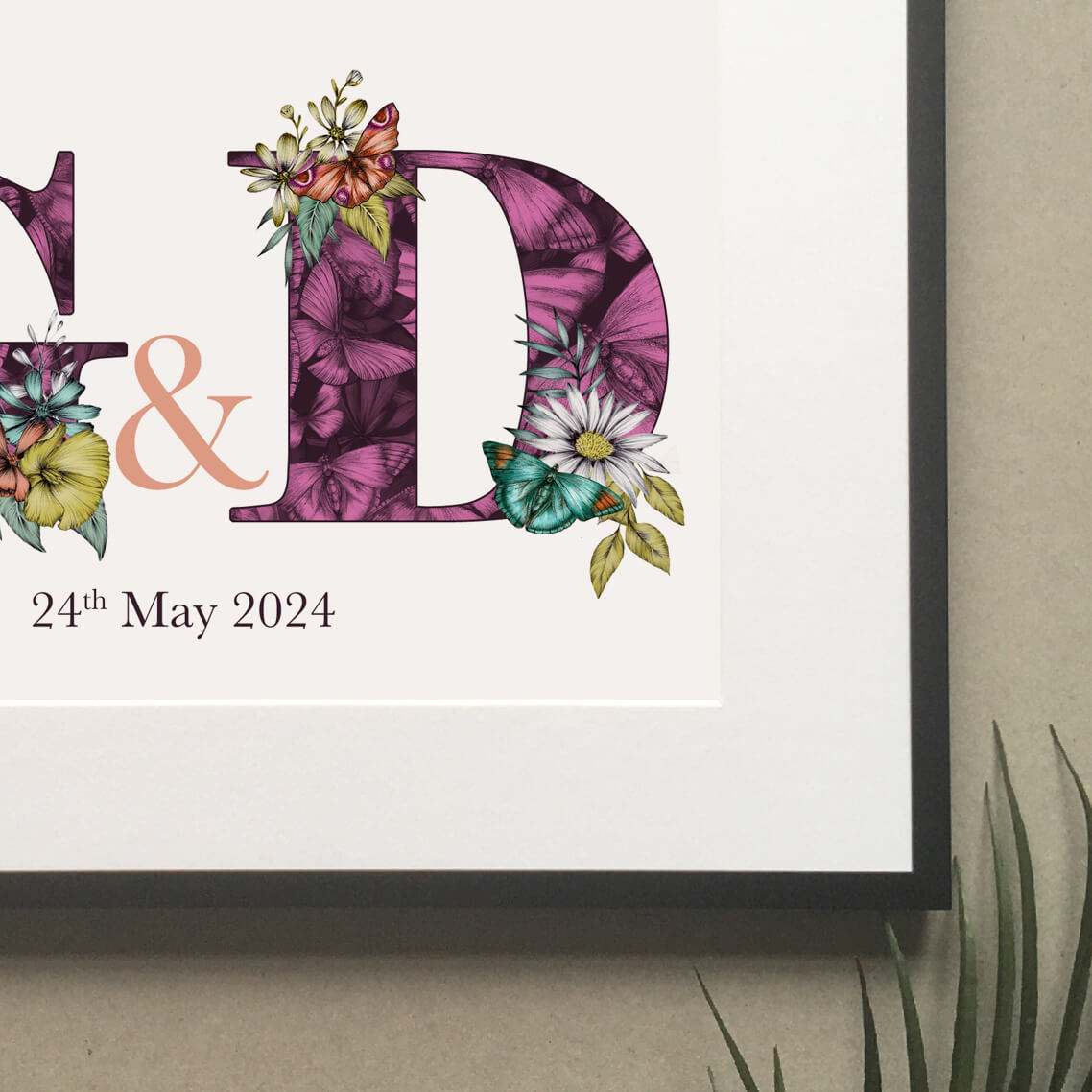 Close up of personalised initial digital print of G & D. Initials are filled with purple fine liner drawings of butterflies and flowers. Under initials 24th May 2024 is printed.