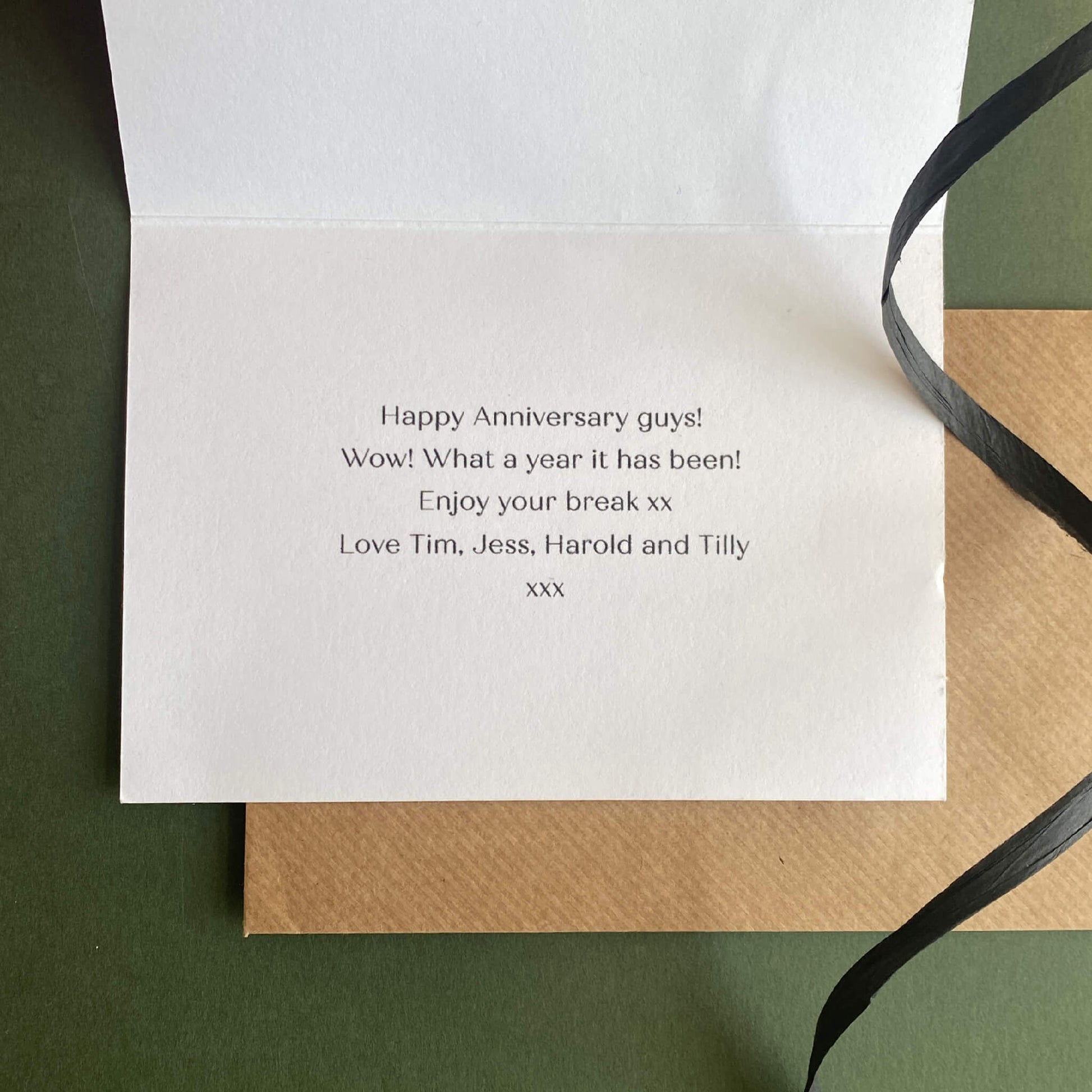 Inside view of a personalised housewarming card with printed message inside.