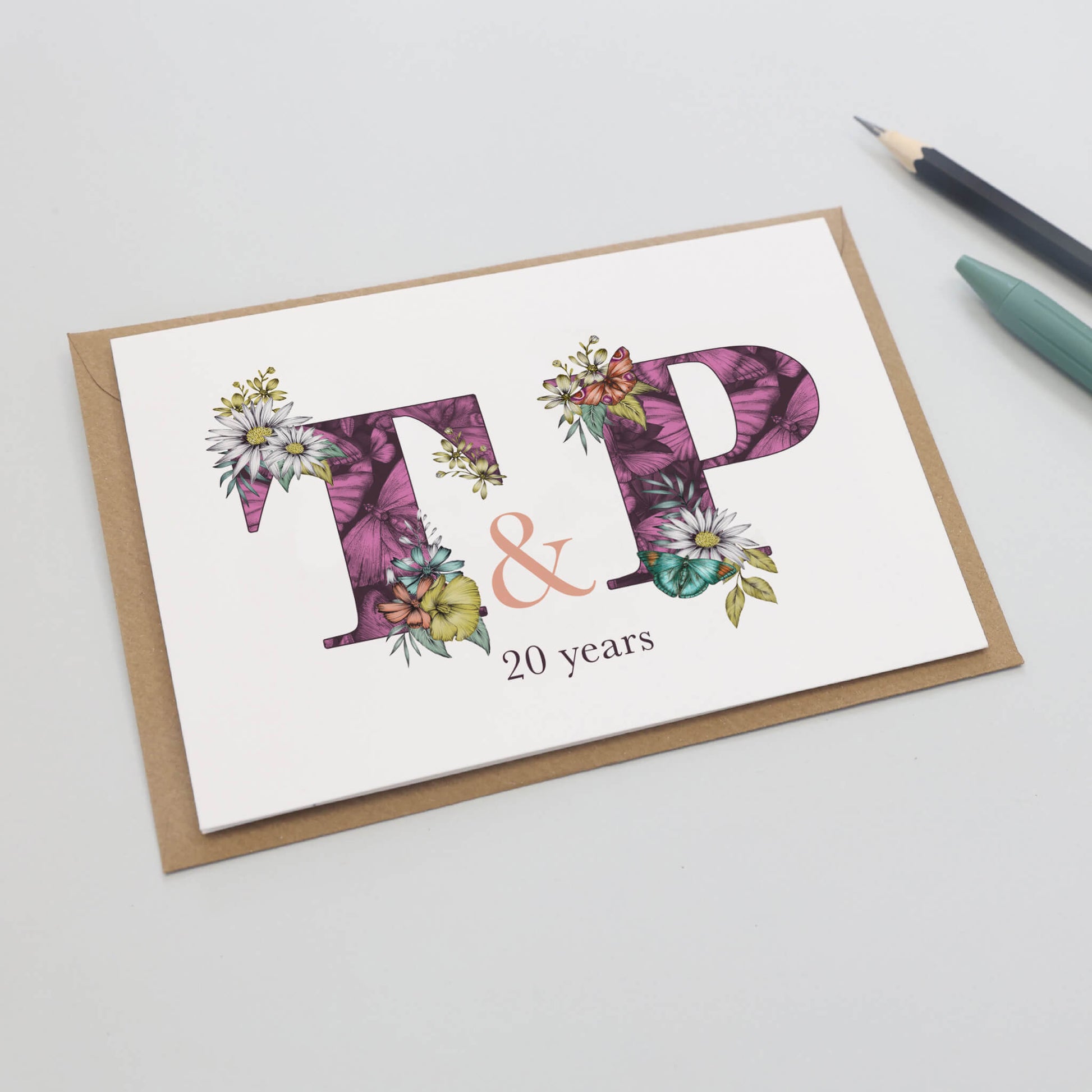 t and p card with 20 years printed underneath card 