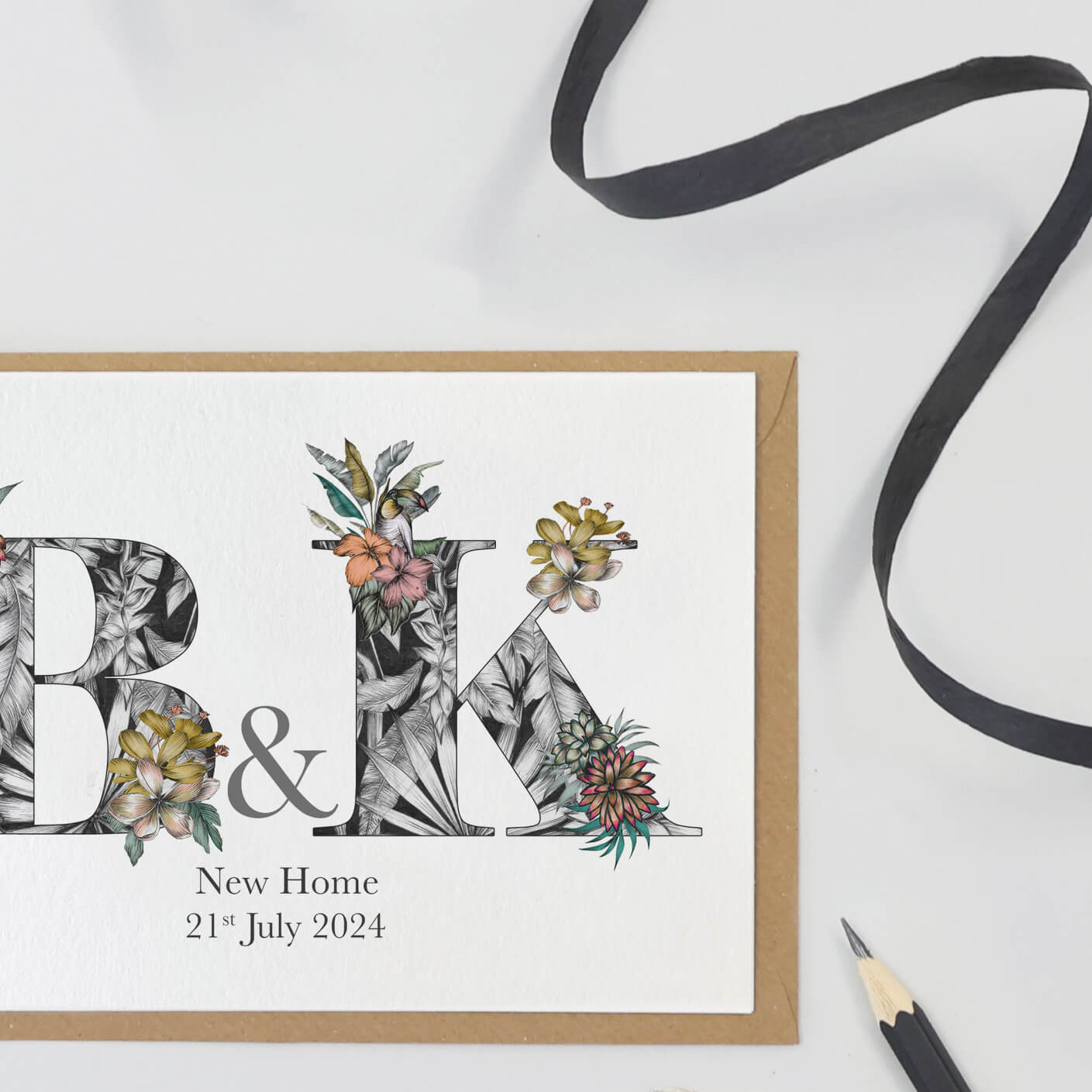 personalised b and k initials housewarming card with with hand-drawn tropical imagery. New home and the couple's moving in date is printed underneath