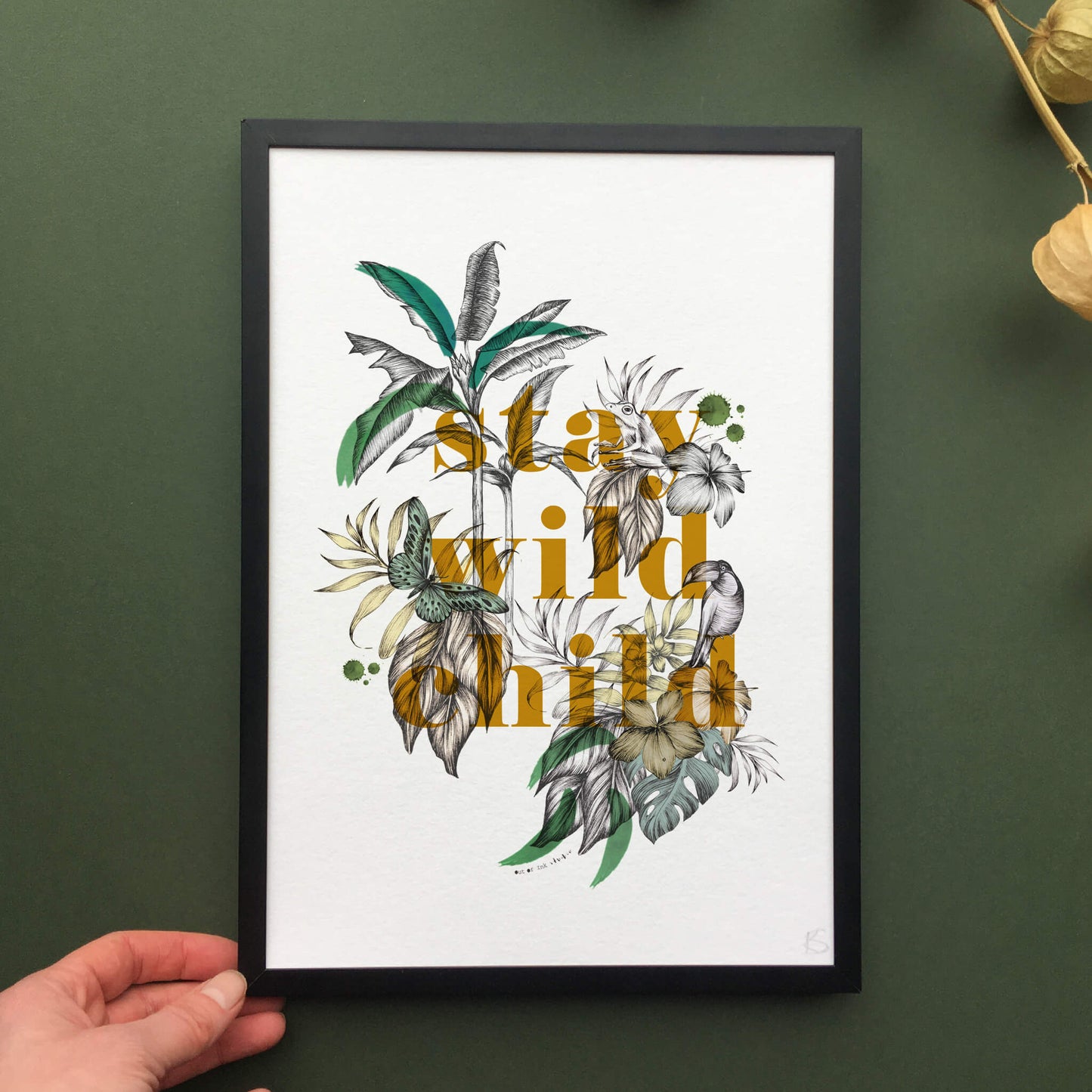 Art print created with fine liner drawings of imagery found in the rainforest. Butterflies, toucan, frog, tropical trees are included. In the centre of the artwork the wording “stay wild child’ is printed.Photos of original drawings before digitised for print.