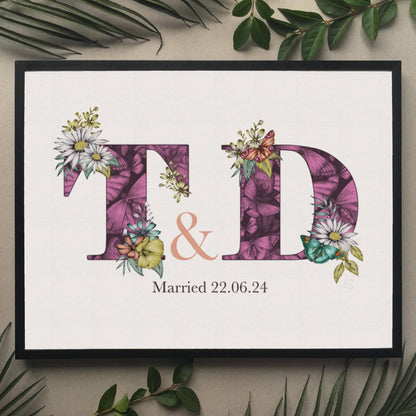 Personalised initial digital print of T & D. Initials are filled with purple fine liner drawings of butterflies and flowers. Under initials married 22.06.24 is printed.